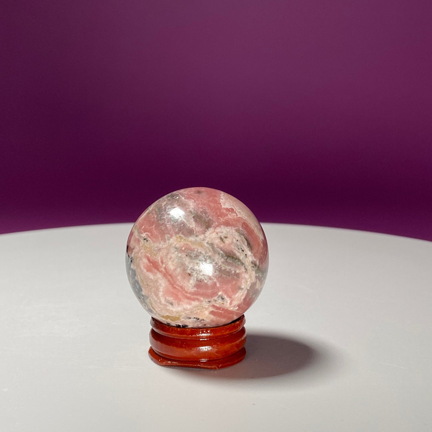 Rhodonite Sphere (Includes Wood Stand)