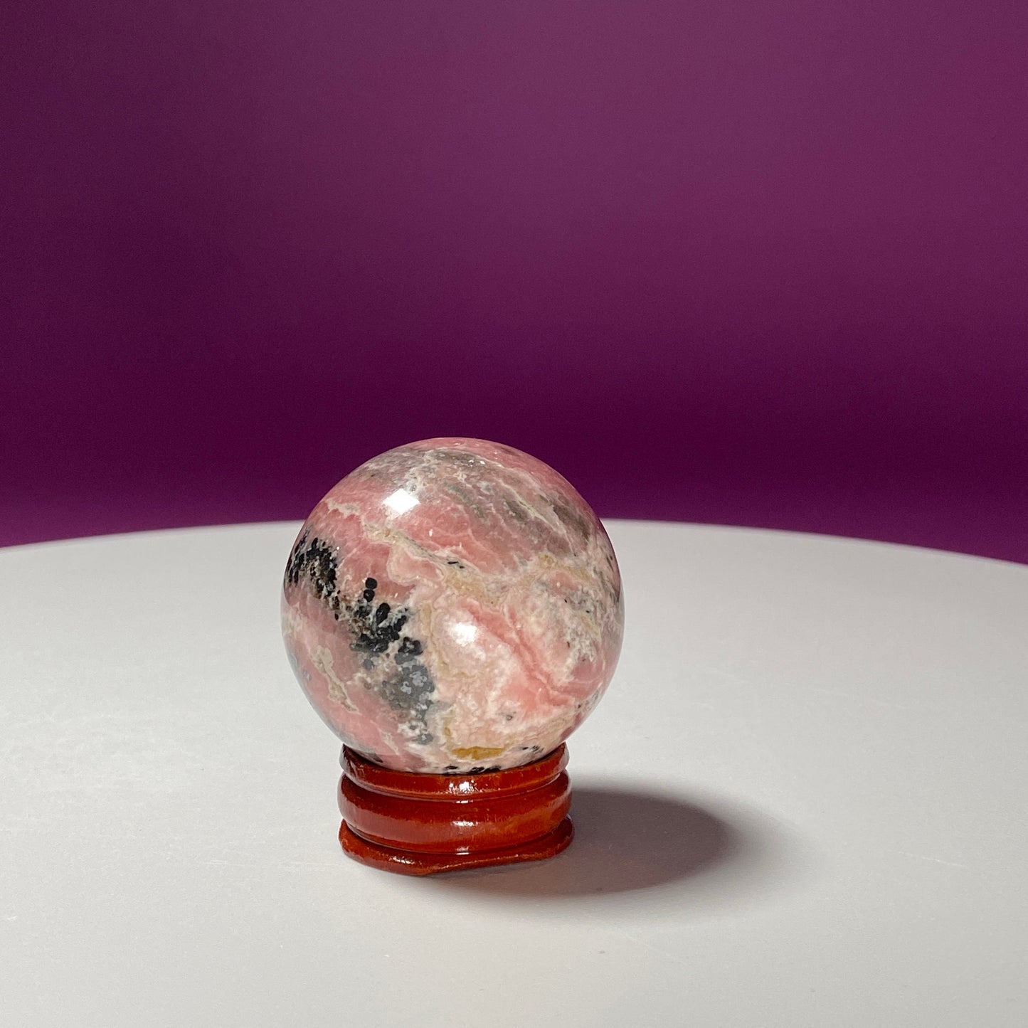 Rhodonite Sphere (Includes Wood Stand)