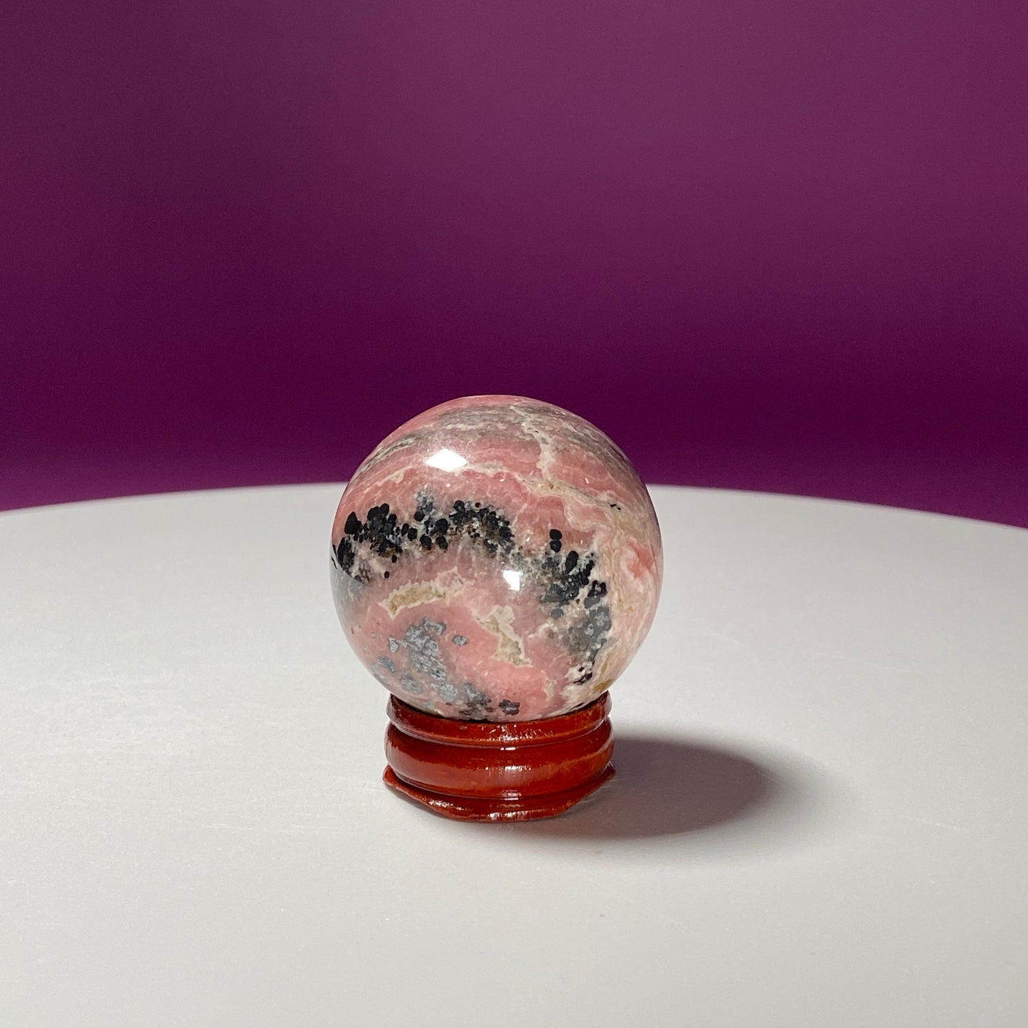 Rhodonite Sphere (Includes Wood Stand)