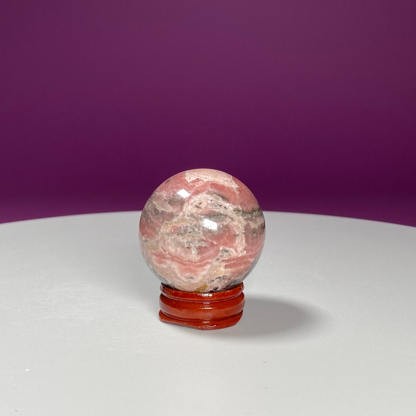 Rhodonite Sphere (Includes Wood Stand)