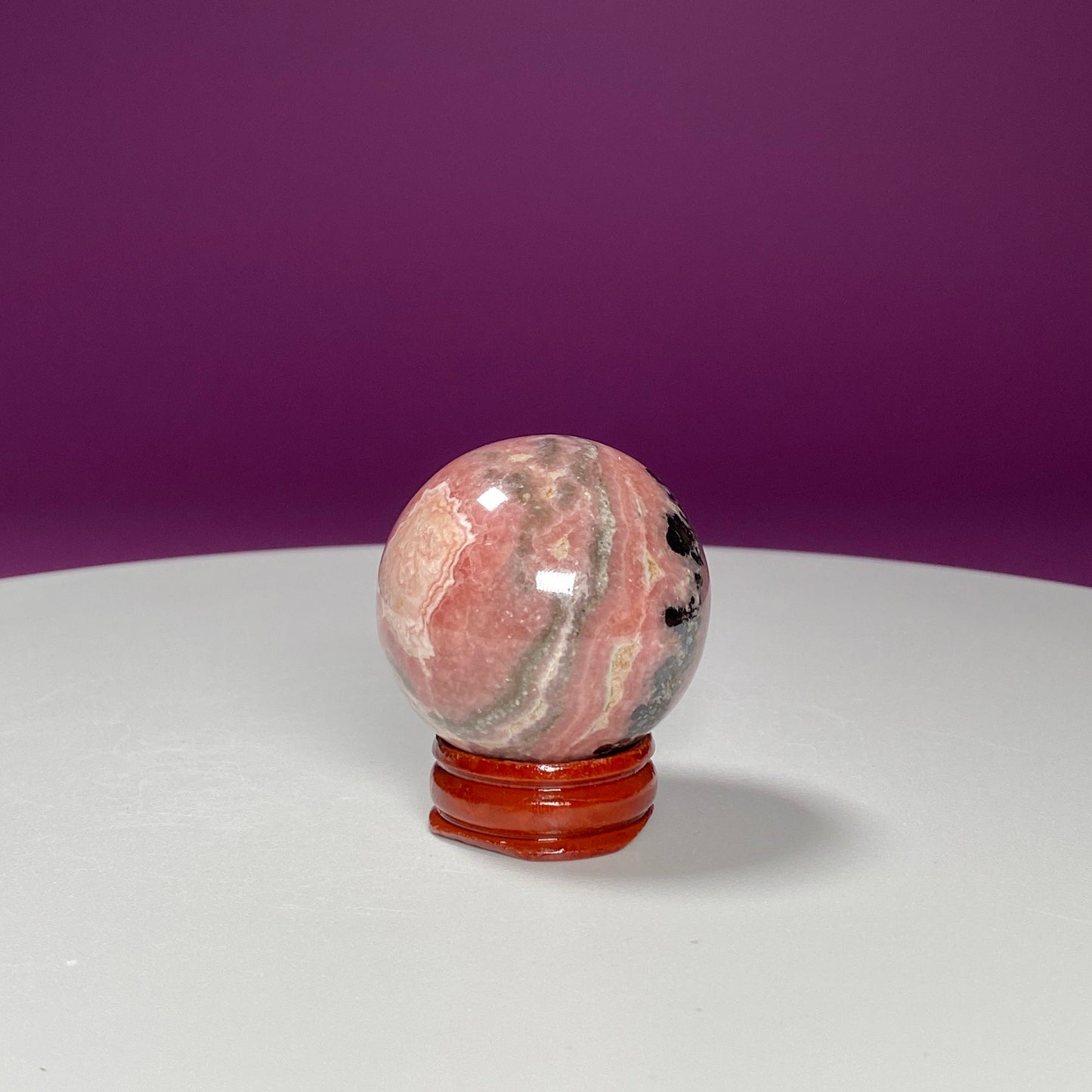 Rhodonite Sphere (Includes Wood Stand)