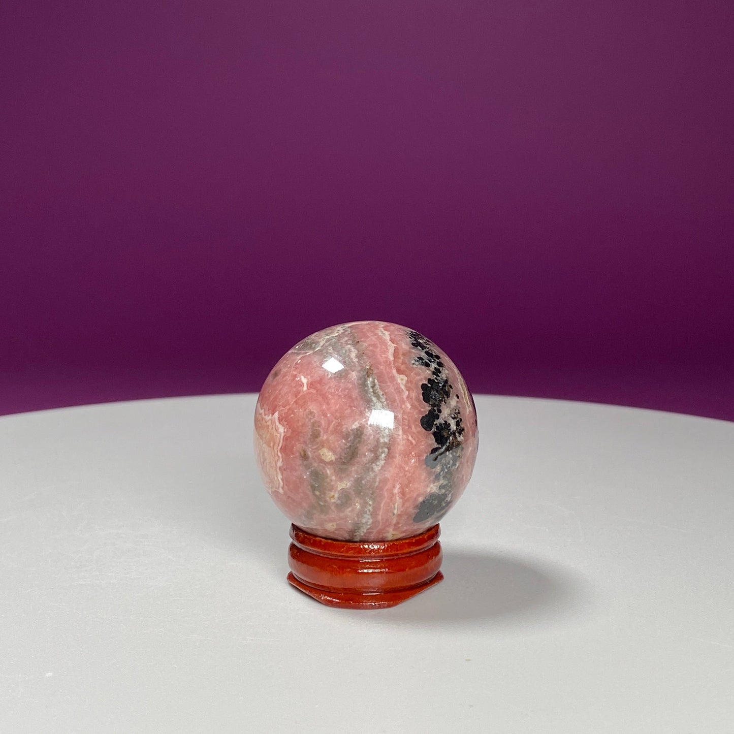 Rhodonite Sphere (Includes Wood Stand)