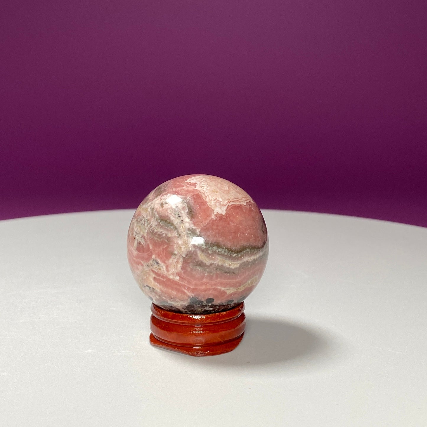 Rhodonite Sphere (Includes Wood Stand)