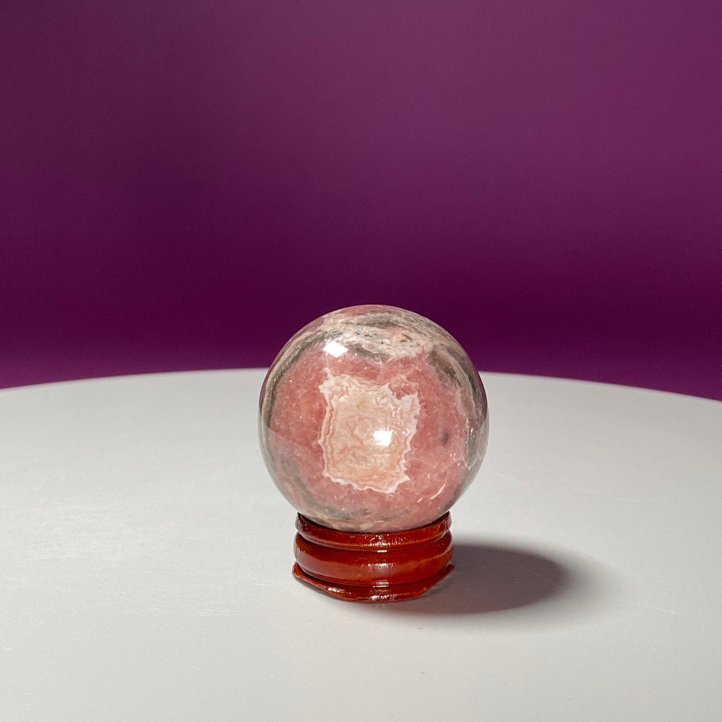 Rhodonite Sphere (Includes Wood Stand)